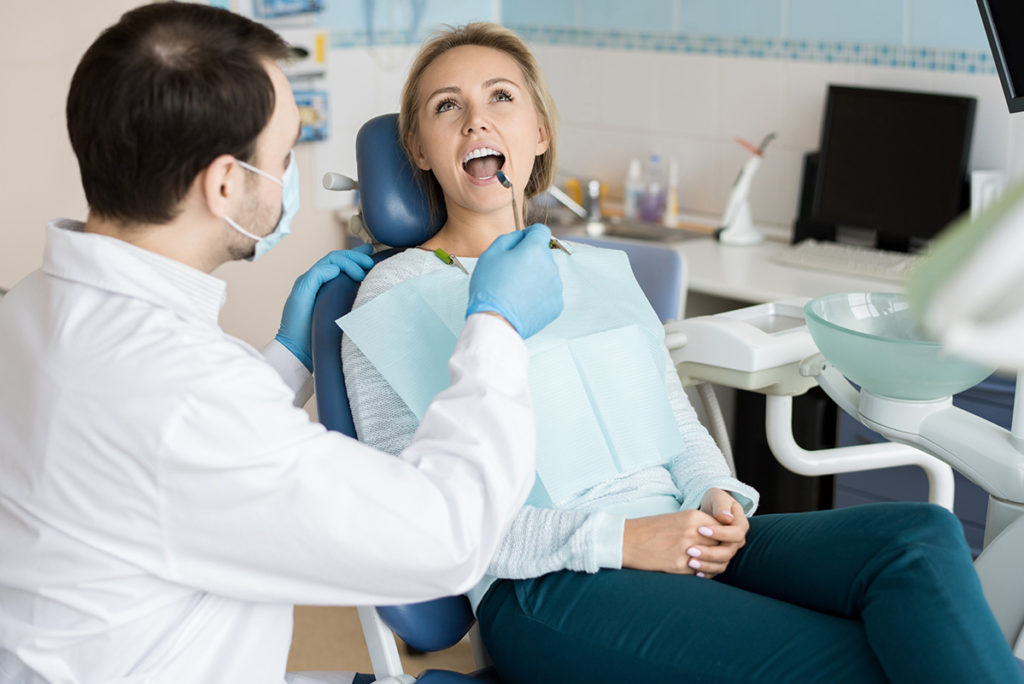 dentist performing dental filling in vancouver